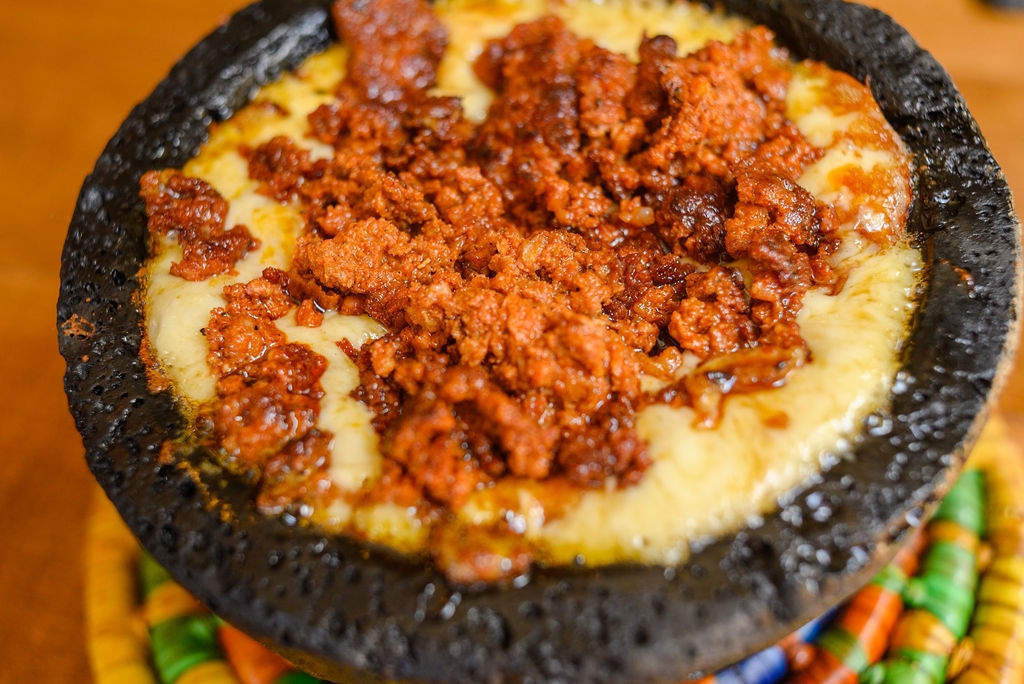 Queso Fundido (not a deep)… Includes 4 flour tortillas (no salsas)